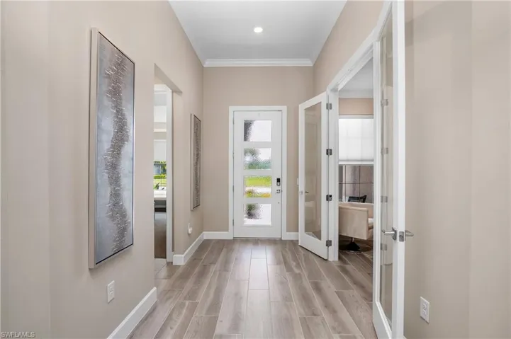 Welcoming foyer entry with crown molding.... perfect place to greet your guests.