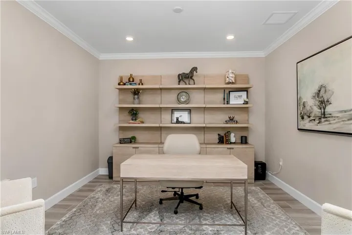 Office/Den is located at the front of the home and includes french doors, crown molding, and lots of natural light.