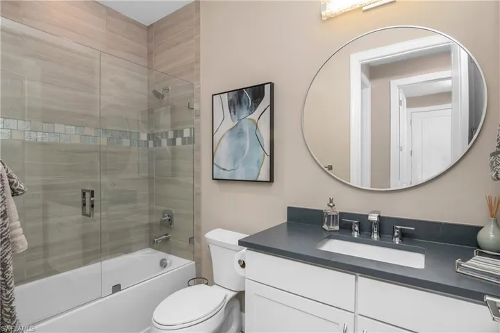 Guest bath with frameless glass shower enclosure.