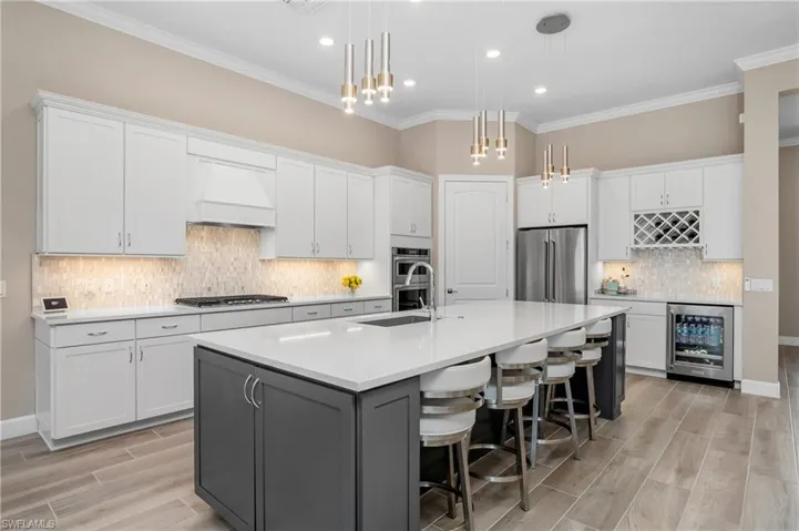 Kitchen also includes wine rack with beverage cooler.