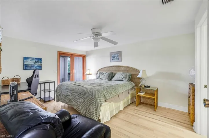 Bedroom with ceiling fan and light hardwood / wood-style floors
