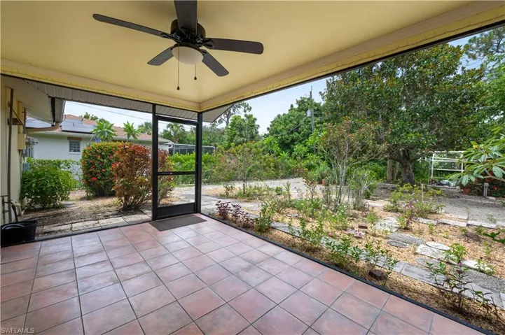 Unfurnished sunroom featuring a ceiling fan and healthy amount of natural light