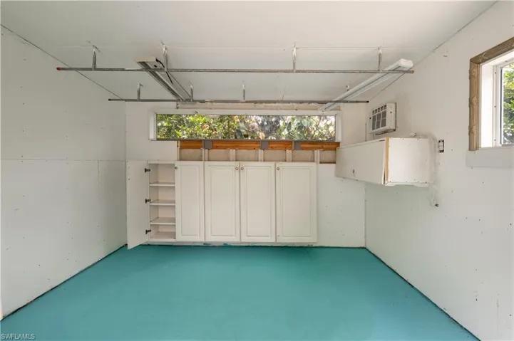 Shed with a wall mounted air conditioner