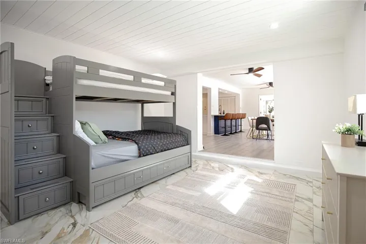 Den featuring kid's playroom with bunk bed