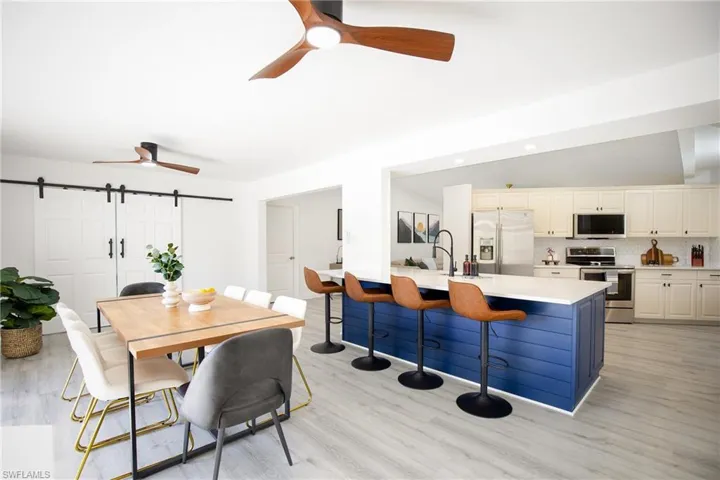 Dining area with kitchen, specious island with bar stools