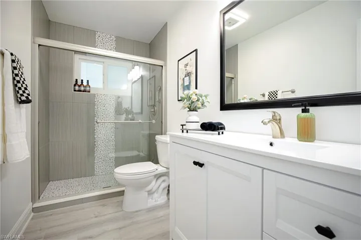2nd Bathroom featuring vanity, a stall shower