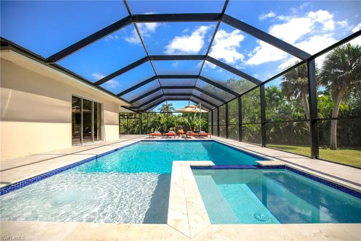 Beautiful, screened pool with a spa