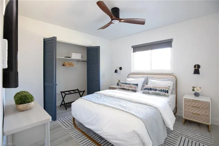 3rd bedroom with a closet, ceiling fan, queen bed and nightstands