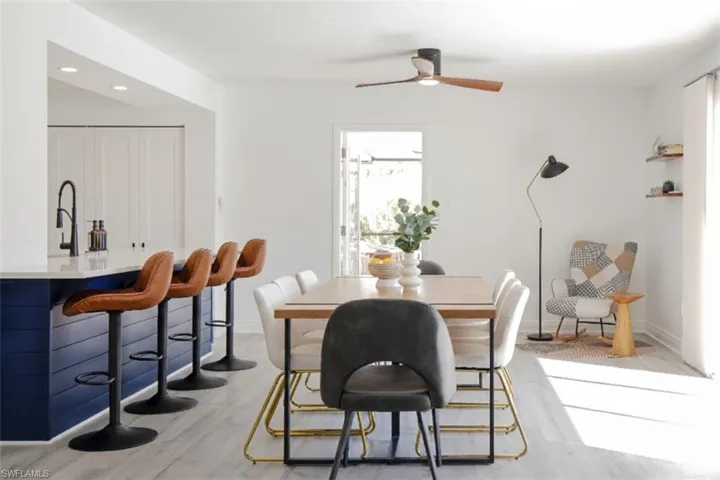 Dining room featuring specious island, bar stool and cozy reading nook