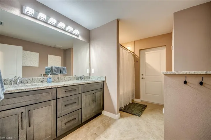 Bedroom featuring access to exterior and ceiling fan