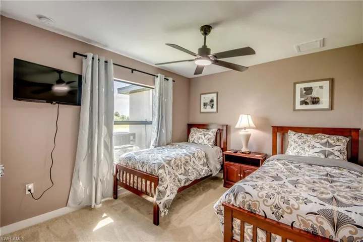 Washroom featuring washer and dryer and light tile patterned floors