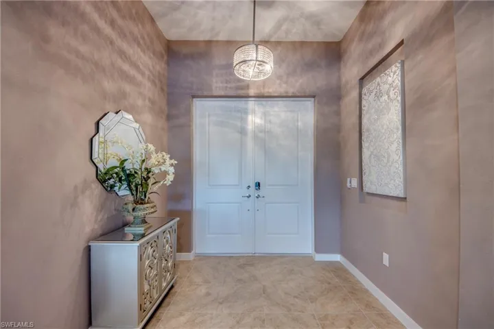 Bathroom featuring plenty of natural light, two vanities, a garden tub, a shower stall, and recessed lighting
