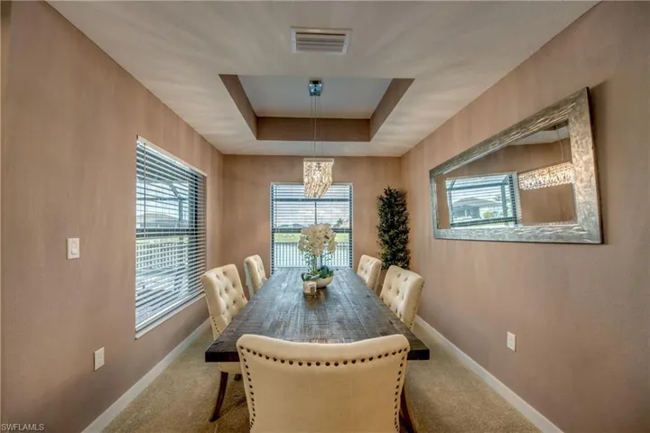 Living area featuring carpet floors and baseboards