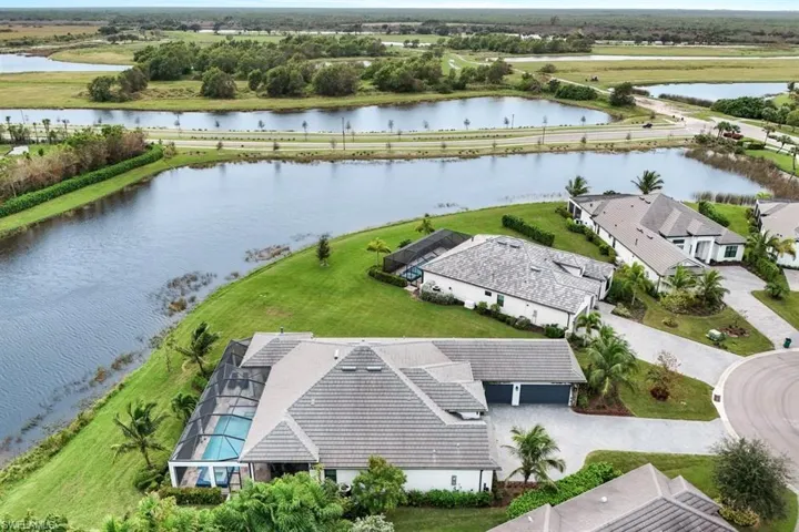 Birds eye view of property featuring a water view