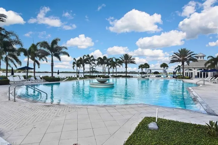 Community pool with a patio area and a gazebo