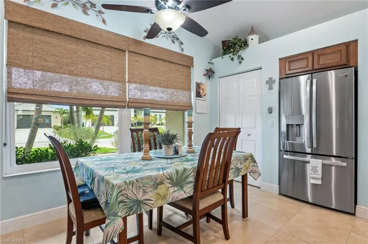 Dining room featuring ceiling fan and light tile patterned floors