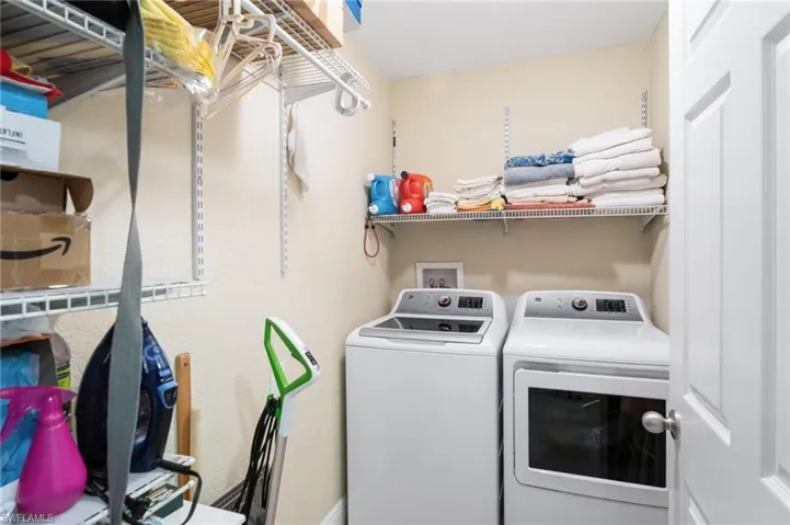 Laundry room featuring washer and clothes dryer