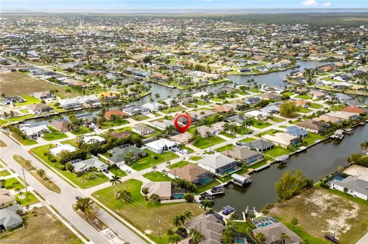 View of property location featuring nearby suburban area and a nearby body of water