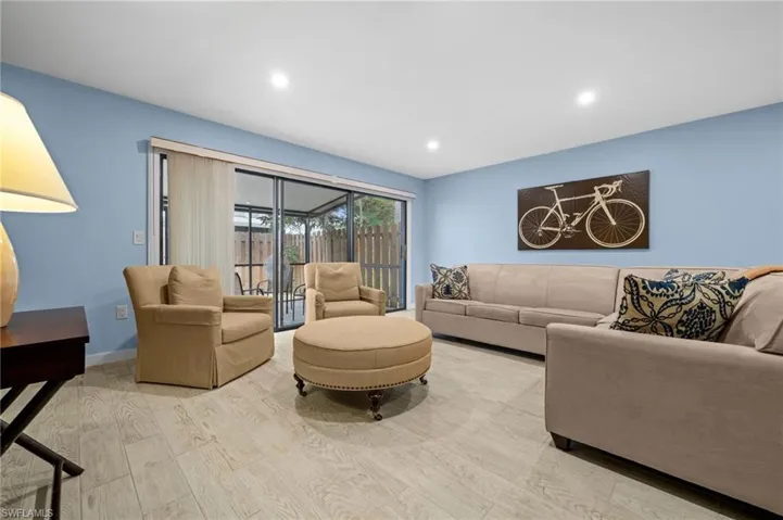 Living room featuring wood finished floors and recessed lighting
