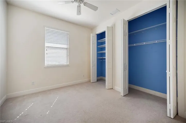 Guest room#2 featuring visible vents, a ceiling fan, and carpet