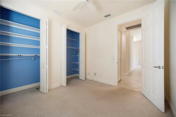 Guest room#2 featuring visible vents, a ceiling fan, and carpet