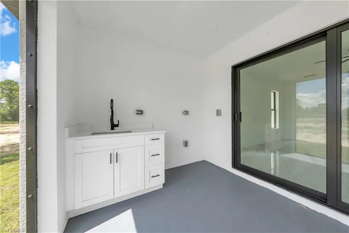 Bathroom featuring vanity and concrete flooring