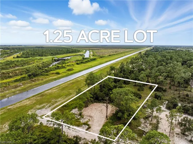 View of property location featuring property parcel outlined and a large body of water