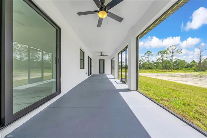 View of patio featuring ceiling fan