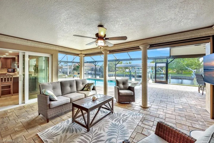 Sunroom featuring ceiling fan