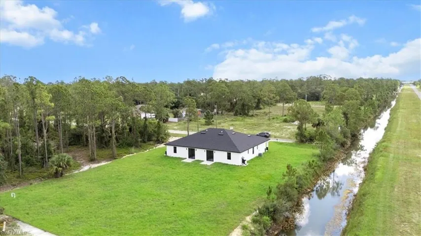 View of subject property featuring a large body of water