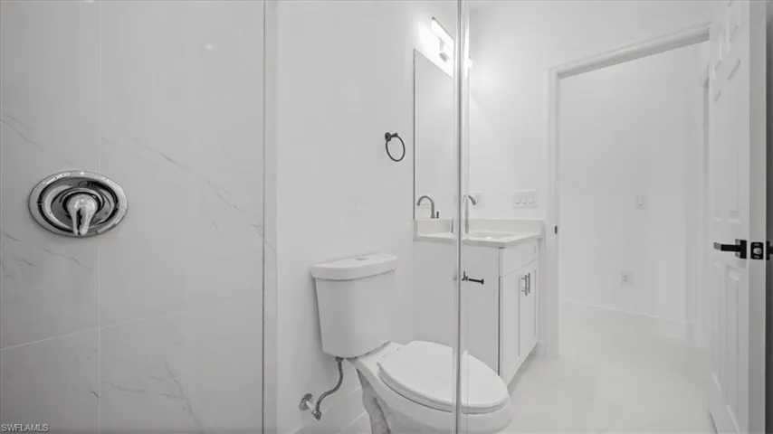 Bathroom with vanity and a shower