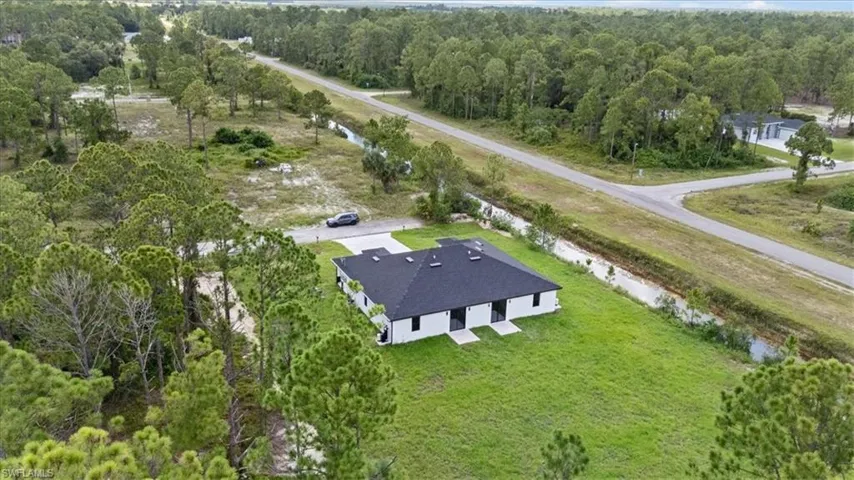 Aerial overview of property's location featuring a forest