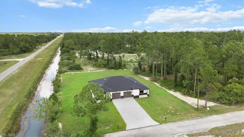 View from above of property with a heavily wooded area