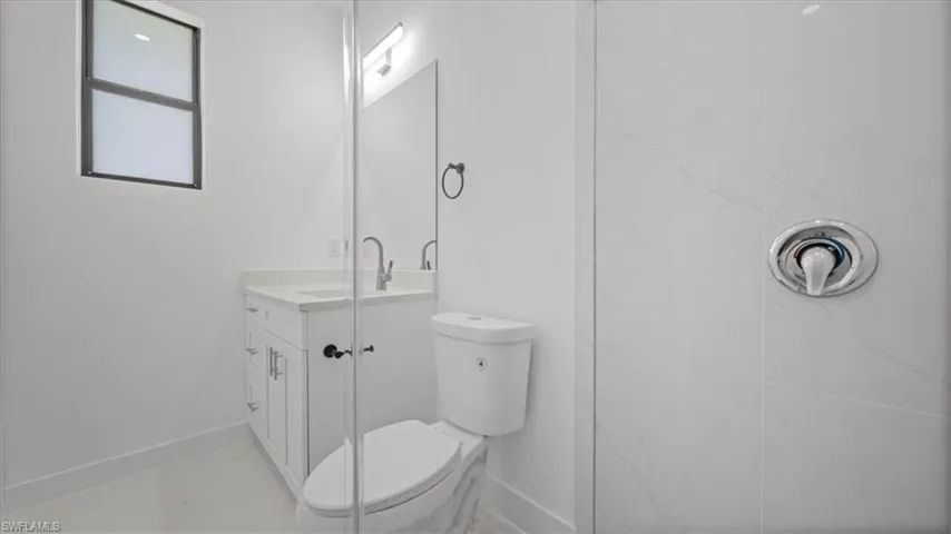 Full bath with toilet and vanity