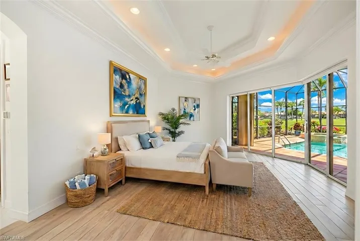Bedroom with access to outside, light wood-style flooring, a ceiling fan, recessed lighting, and ornamental molding