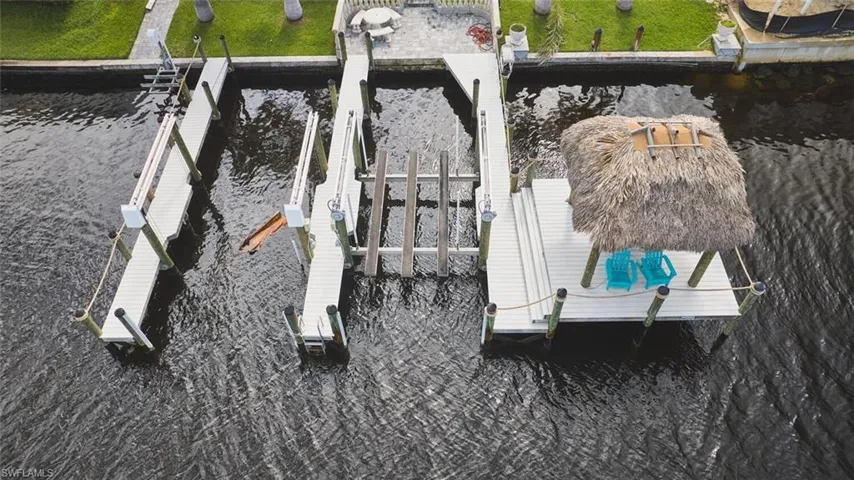 Dock featuring a water view and boat lift