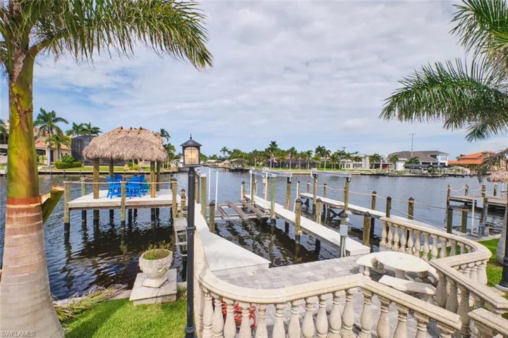 Dock area with boat lift and a water view