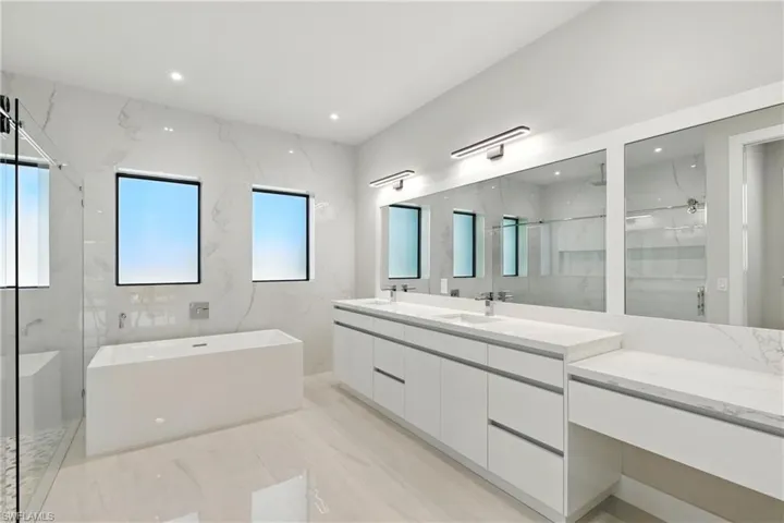 Master bathroom deep tub. Lots of natural light.