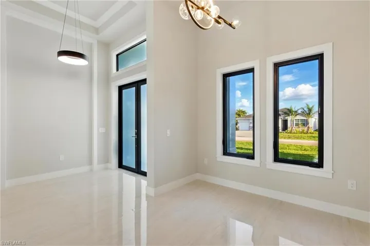 Entrance and dining area with impact windows that open and have screens