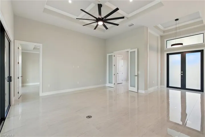 Entrance, living area, double doors to 4th bedroom/den with closet
