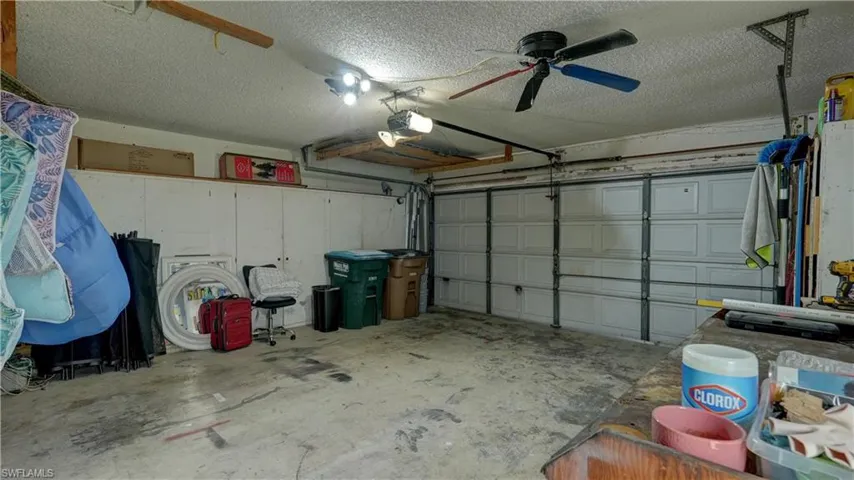 Garage interior featuring a sectional overhead door and built-in storage cabinetry