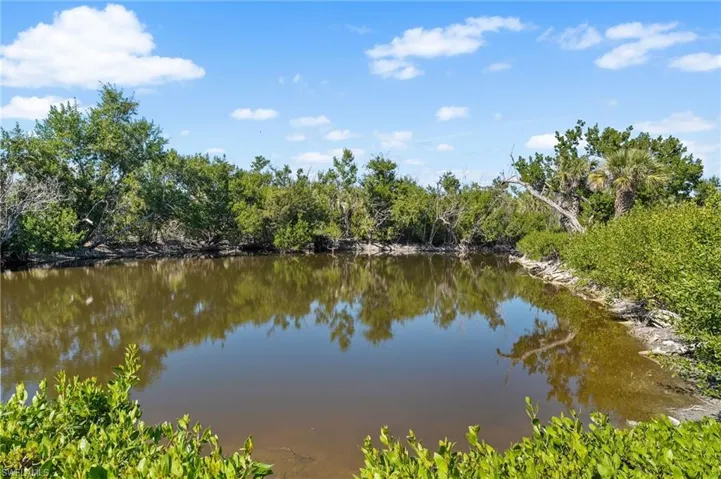 Positioned along peaceful lake waters, this home captures the quiet beauty of Sanibel.