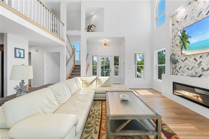 Expansive windows bring the outdoors in, creating a bright and airy gathering space.