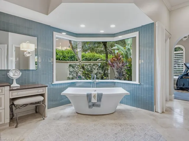 Primary bathroom with view of private orchid garden