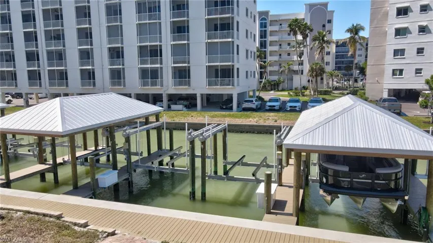 Dock area with boat lift and a water view