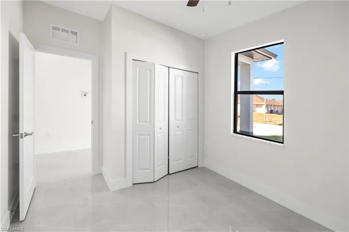 Unfurnished bedroom featuring a closet and ceiling fan