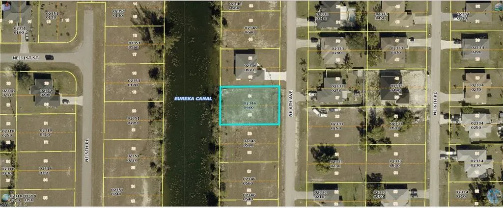 Aerial map of property and surrounding area featuring property parcel outlined