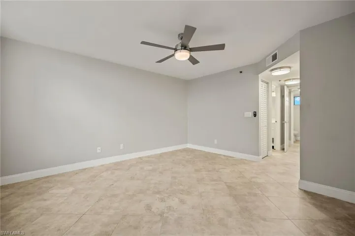 Spare room with ceiling fan