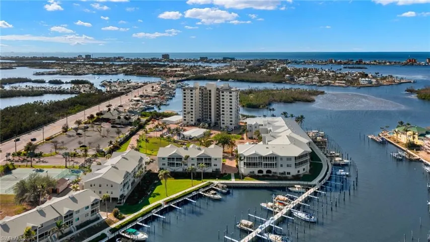 Birds eye view of property with a water view