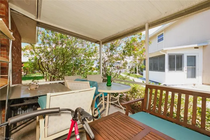 Wooden deck featuring outdoor dining area